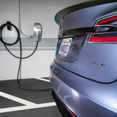 A TESLA Plaid plugged into a charging station at the Sunset Marquis in their Electric Vehicle garage.