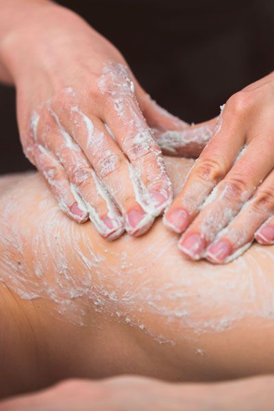 A person getting a detoxifying body scrub in West Hollywood’s coolest SPA