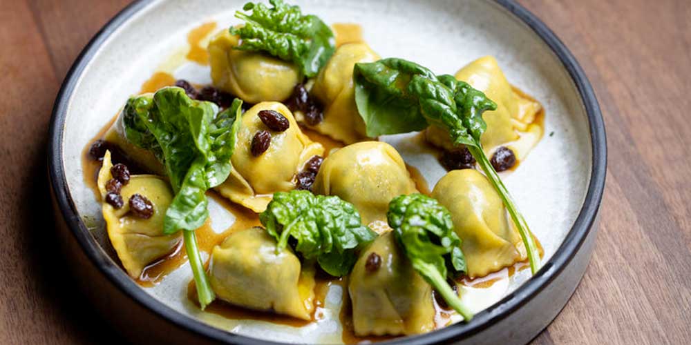 Tesse Restaurant - Delectable looking pasta filled with something most likely fabulous and garnished with fresh basil leaves.